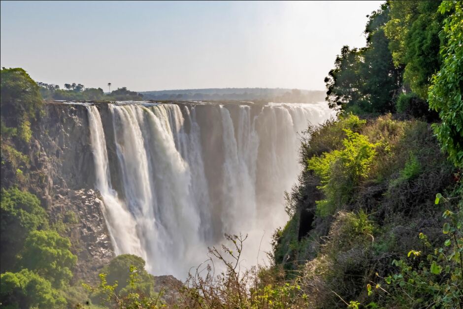 A rainbow over Victoria Falls seen from the Zimbabwean bank of the Zambezi
